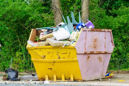 Waste clearance truck removing debris in South West London